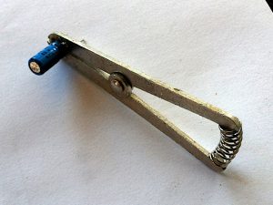 capacitor held in heatsink clamp
